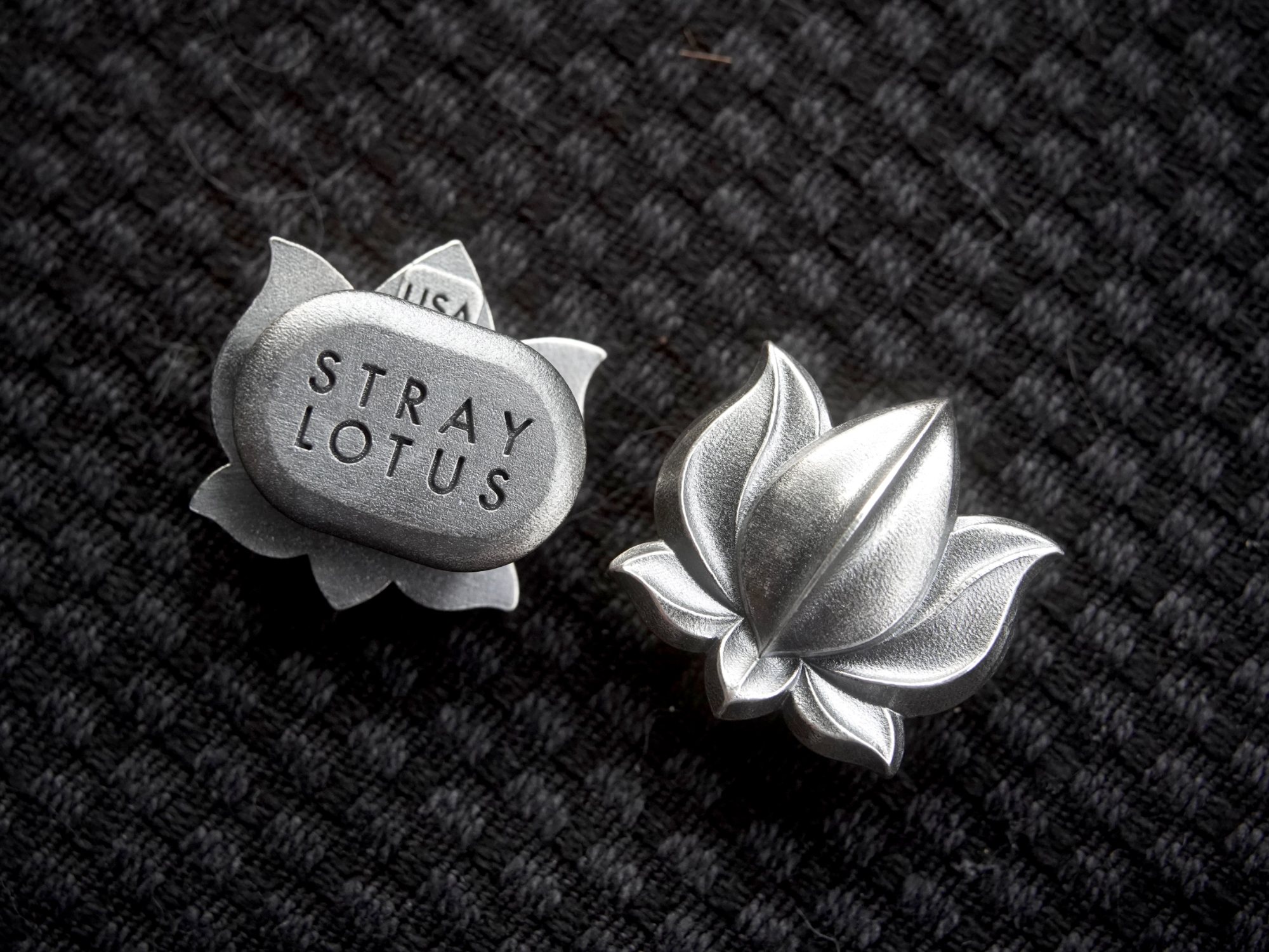 Lotus 001 showing the relief face and the reverse with its backstamp